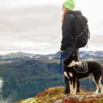 veterinary nurse hiking ith a dog in Norway
