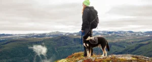 veterinary nurse hiking ith a dog in Norway